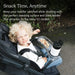 Toddler sitting in stroller with snack tray and drink holder outdoors