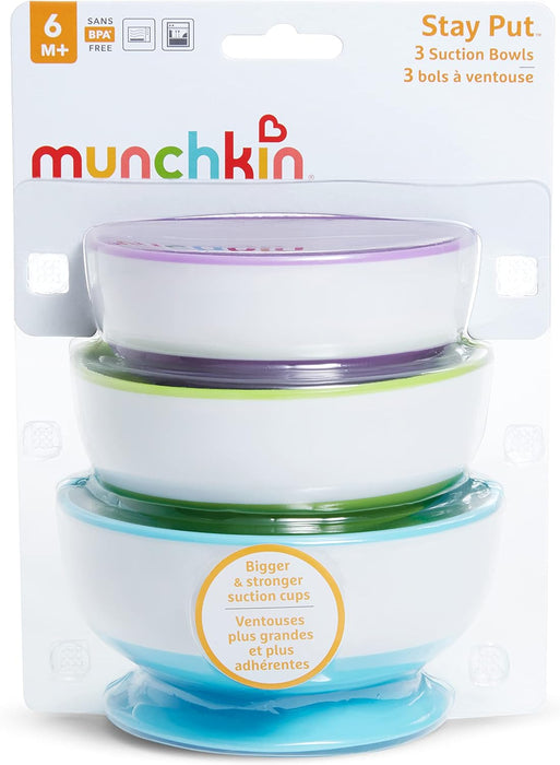 Munchkin Stay Put suction bowls set of three in retail packaging, colorful lids stacked together.