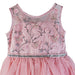 Girls’ glitter bow dress in gold rose with floral and butterfly embroidery shown close-up on a hanger.