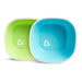 Munchkin toddler bowls in green and blue with white rims, shown side by side on a white background.