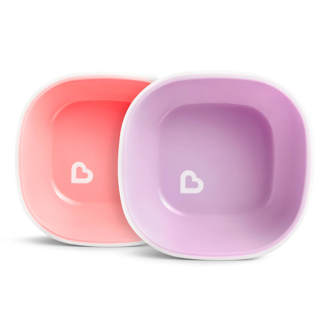 Munchkin two-pack baby bowls in pink and purple shown side by side on a white background.