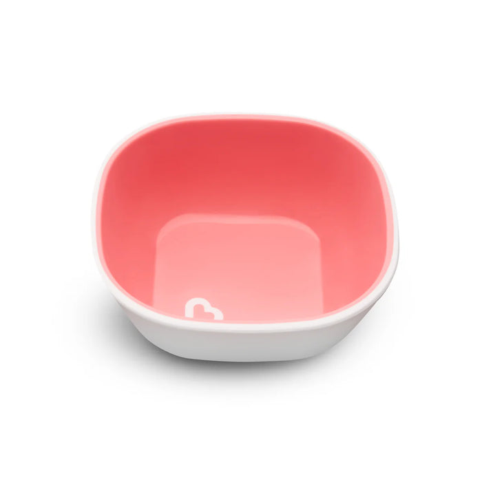 Munchkin square pink baby bowl with white exterior shown on a white background.