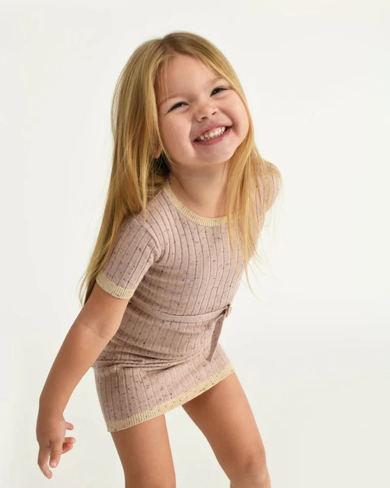 7AM Hug Me Ribbed Knit Dress in ash rose worn by a smiling girl posing against a white background.