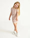 7AM Hug Me Ribbed Knit Dress Ash Rose shown on a smiling child standing against a white background.