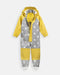 7AM Enfant rain coverall in yellow and grey with white stars, shown flat on a white background.