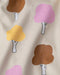 7AM rain jacket with colorful tree print and water droplets on cream fabric
