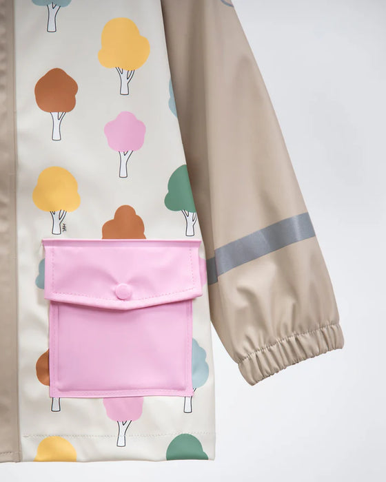 Children's rain jacket with colorful tree print and pink pocket, shown on a white background.