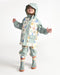 Child wearing a pastel rain jacket set with hood and boots on a plain white background.