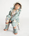 7AM rain jacket kids mint green with matching boots and hat, shown worn by a child sitting on a chair.