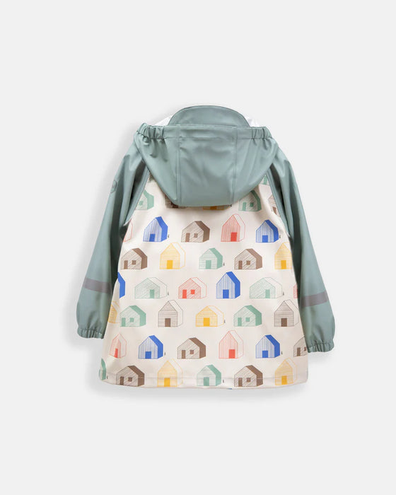 Children's rain jacket with sage green hood and sleeves, house pattern on back, shown flat on white background.