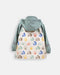 Children's rain jacket with sage green hood and sleeves, house pattern on back, shown flat on white background.