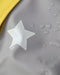 7AM rain jacket close-up showing waterproof fabric with white star print and water droplets.
