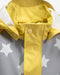Yellow and grey 7AM rain jacket with star print, close-up of collar and front snaps.