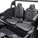 Kids ride-on car black interior with two seats and seat belts, shown from above.