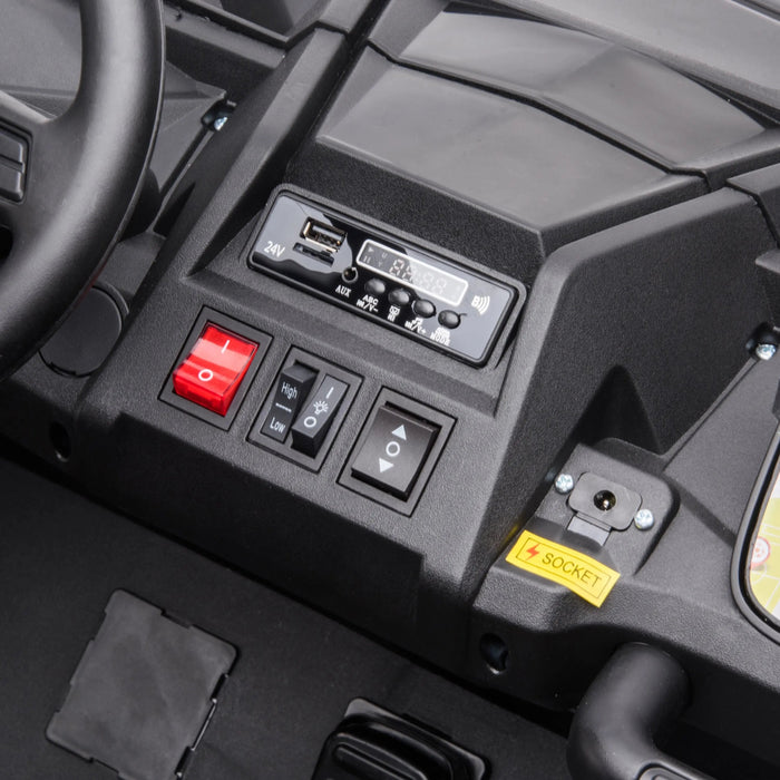 Ride-on toy car dashboard close-up with control switches, USB port, and labeled socket.
