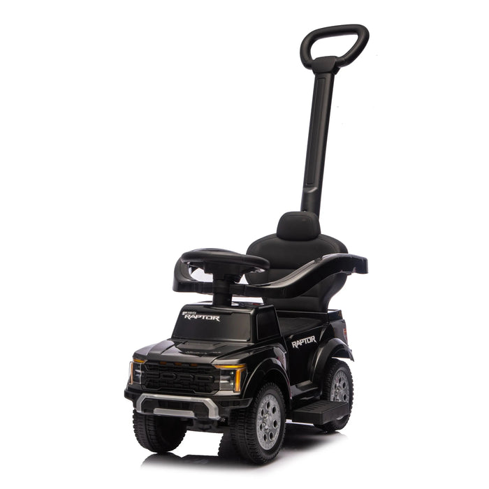 Ford Raptor black ride-on toy car for kids with push handle shown on white background.