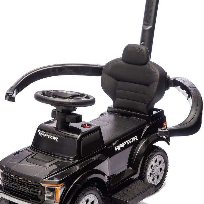 Ford Raptor black ride-on toy car for kids shown close-up with safety bar and steering wheel.