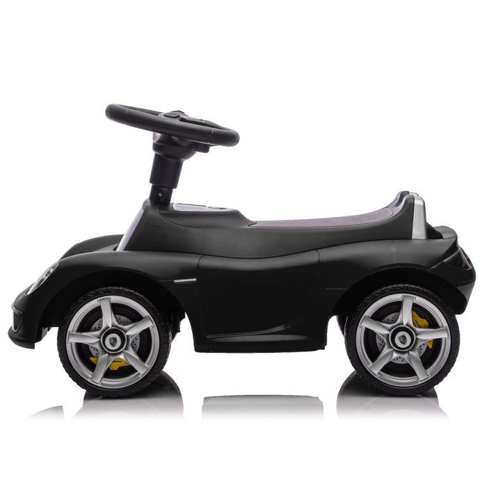 Black ride-on toy car for kids shown in profile on a white background.
