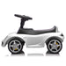 White ride-on toy car for kids on a white background, side profile showing wheels and steering wheel.