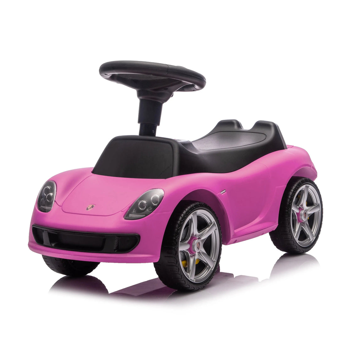 Pink Porsche ride-on toy car for kids shown on a white background.