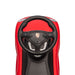 Red Porsche ride-on toy car showing the steering wheel and dashboard from above.