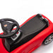 Porsche kids ride-on car top view showing black seat and steering wheel on white background.