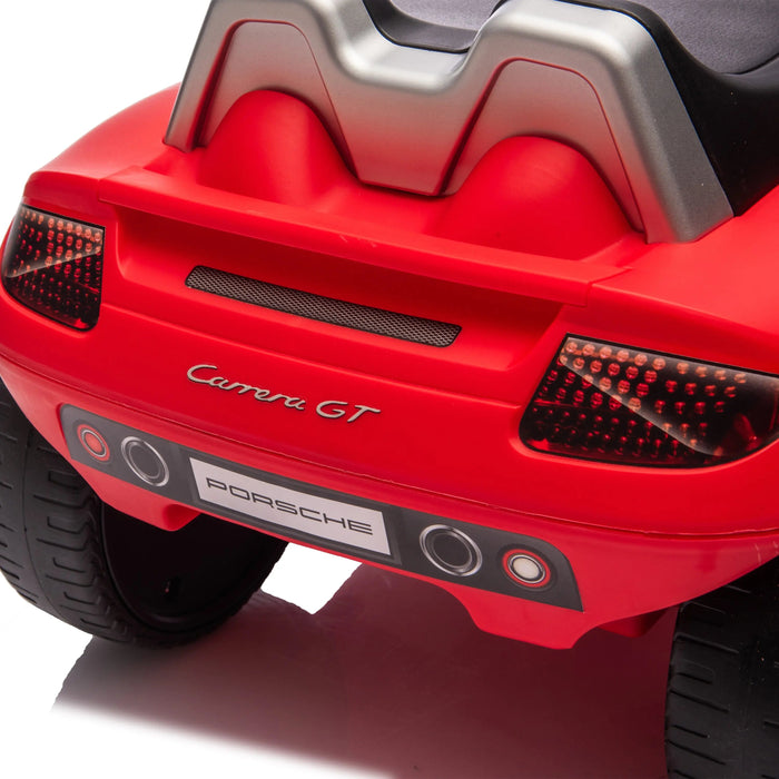 Red Porsche Carrera GT ride-on toy car rear view showing taillights and branding details.