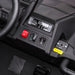 Ride-on toy car dashboard close-up showing power switch, control buttons, and USB input.