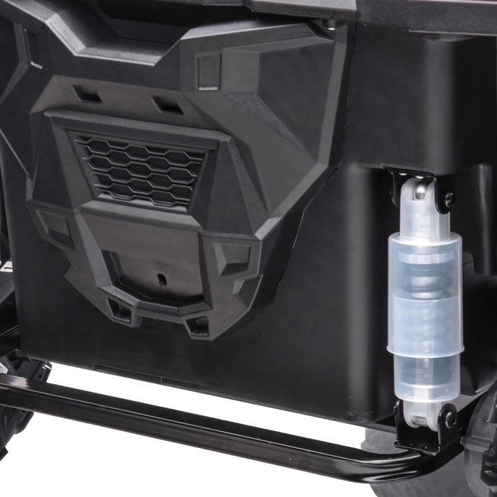 Close-up of stroller suspension system showing detailed shock absorber and wheel frame.