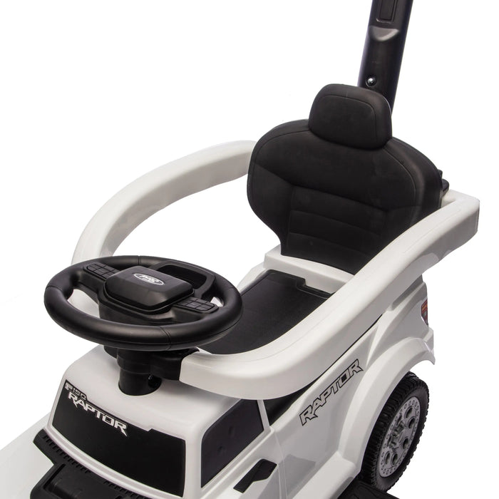 F150 Raptor ride-on toy car close-up showing black seat and steering wheel.