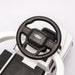 Ford kids' ride-on car steering wheel and dashboard close-up, shown from above.