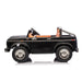 Ride-on black toy car for kids shown from the side on a white background.