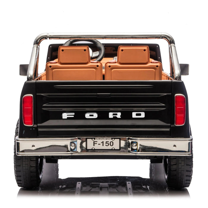 Ford F-150 kids ride-on toy car shown from the rear with brown seats and realistic detailing.