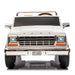 Ford F-150 kids ride-on toy truck in white shown from the front with headlights on.