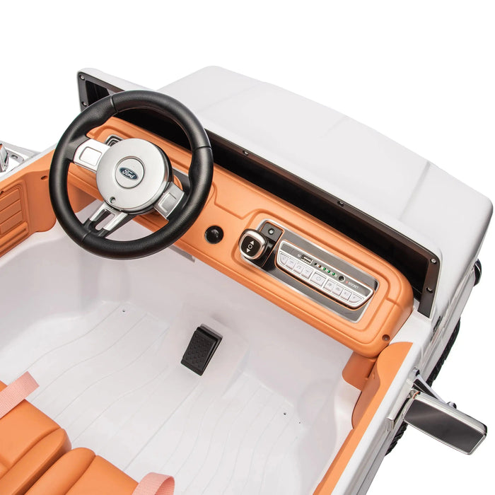 Ford kids ride-on car detailed dashboard and steering wheel interior view.