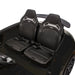 Kids electric ride-on car interior with two black seats and seatbelts, close-up view.