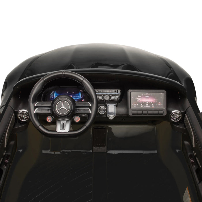 Kids' ride-on toy car dashboard and steering wheel with interactive controls and digital display.
