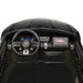 Kids' ride-on toy car dashboard and steering wheel with interactive controls and digital display.