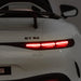 GT 63 kids ride-on car shown from the rear with illuminated tail lights in an indoor setting.