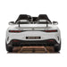 Mercedes-AMG GT 63 kids ride-on car rear view, two seats, white color, on white background.
