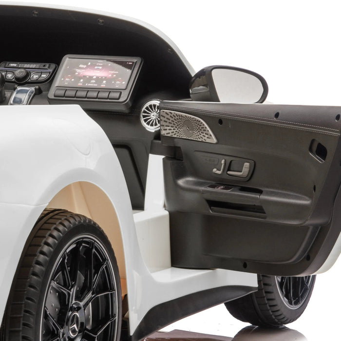 Kids ride-on electric car interior showing open door and detailed dashboard features.