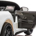 Kids ride-on electric car interior showing open door and detailed dashboard features.