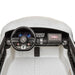 Kids ride-on Mercedes dashboard with steering wheel, control panel, and touchscreen display.