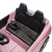 Pink kids ride-on car with two black seats and seatbelt, viewed from above.
