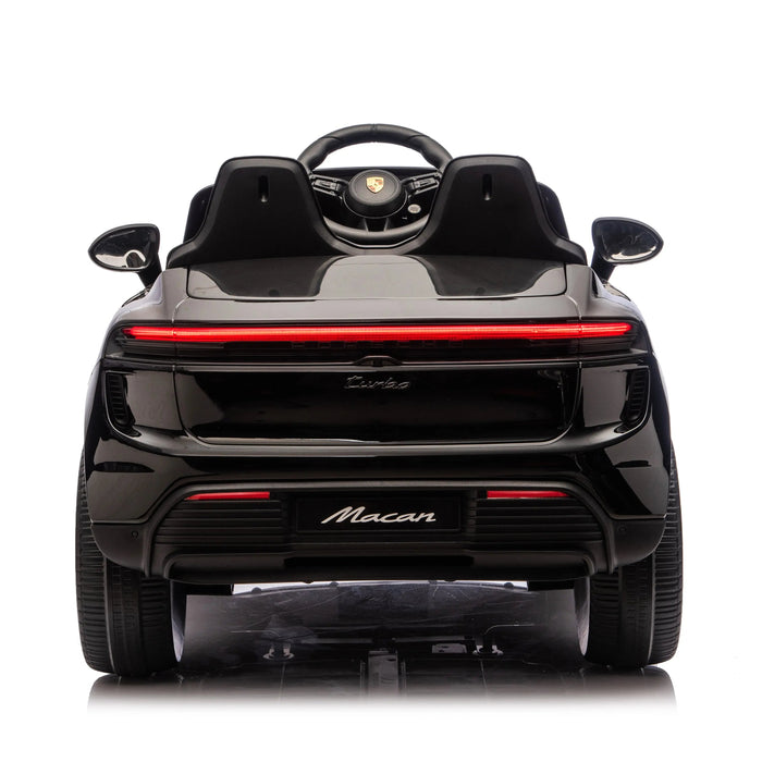 Porsche Macan kids ride-on car in black, rear view detail with visible logo and seats.