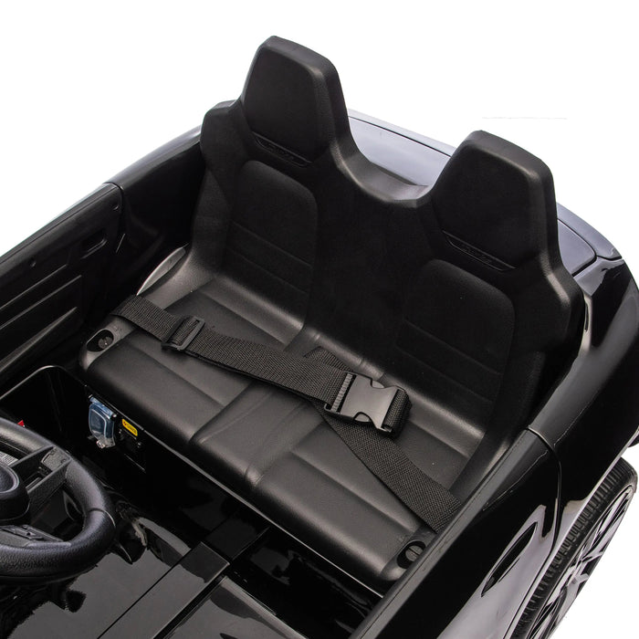 Kids' electric ride-on car black interior featuring two seats and a seat belt close-up.