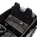 Kids' electric ride-on car black interior featuring two seats and a seat belt close-up.