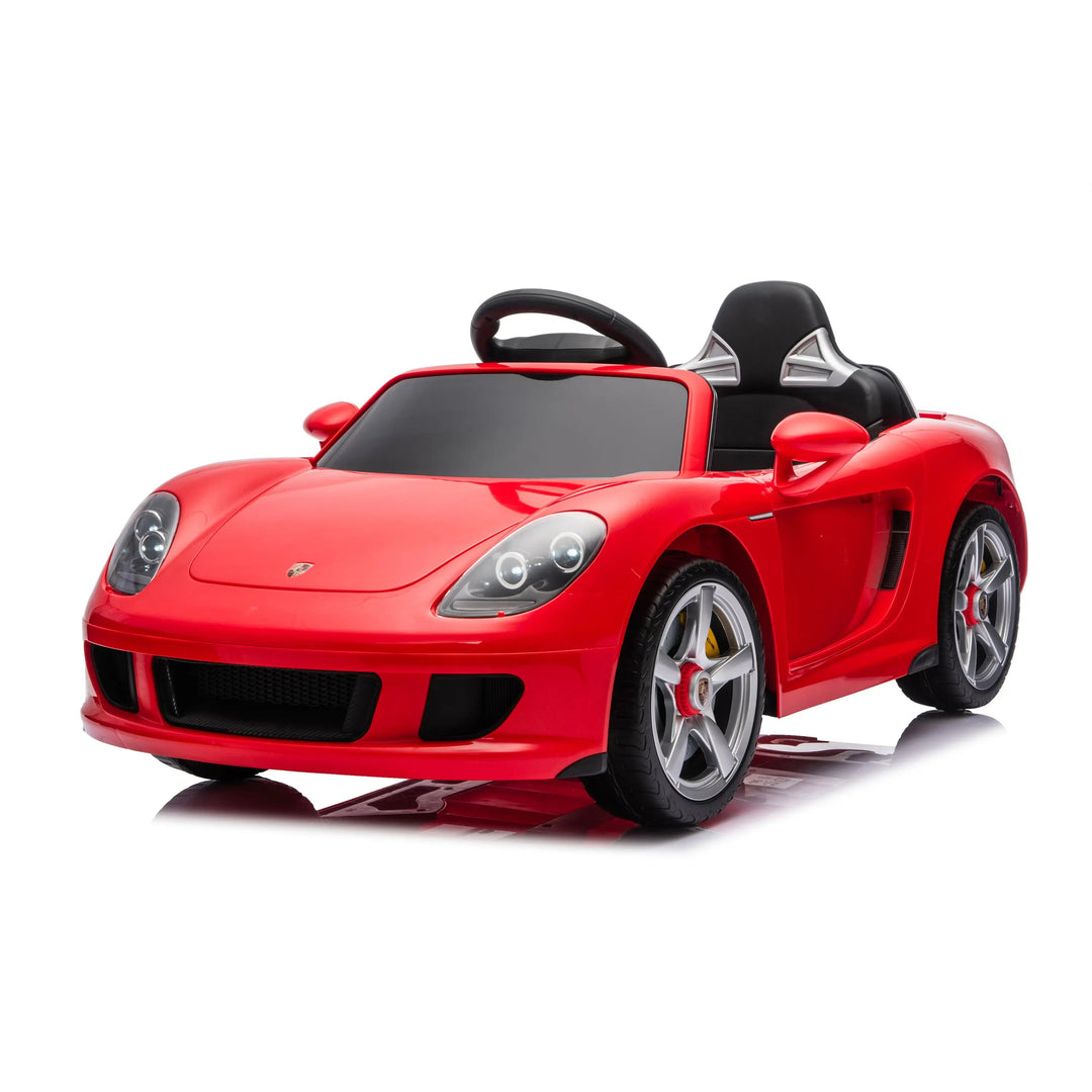 Red kids’ ride-on sports car with black seat, shown on a white background.