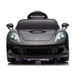Black kids ride-on car with LED headlights shown from the front on a white background.