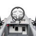 Children's ride-on toy car dashboard showing steering wheel, pedals, and control panel.